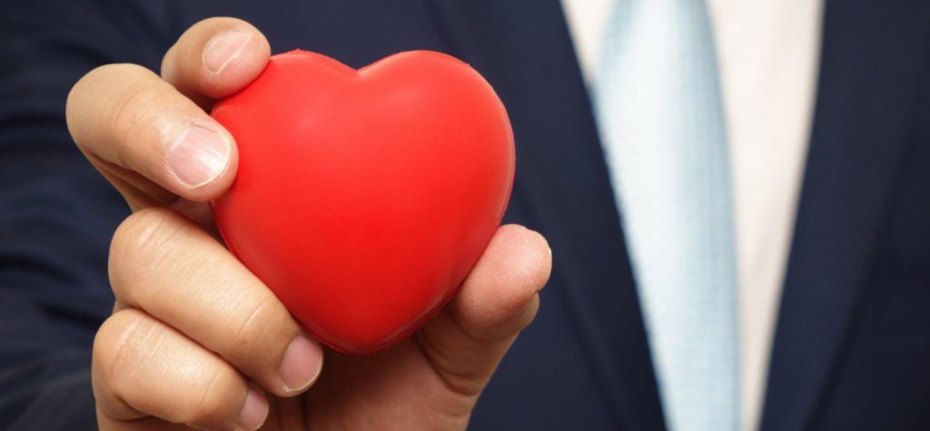a person holdinga heart shaped object