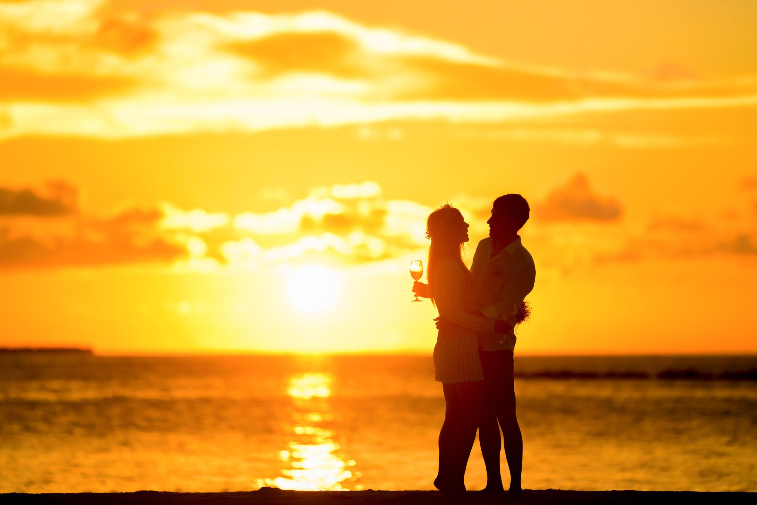 A Couple Enjoying The Sunset