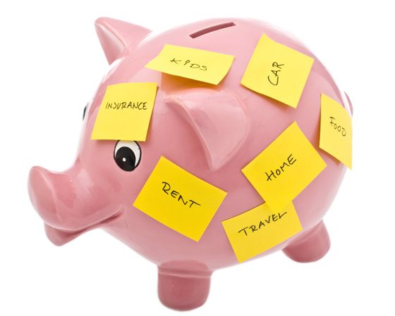 piggi bank with flash cards having some financial goals