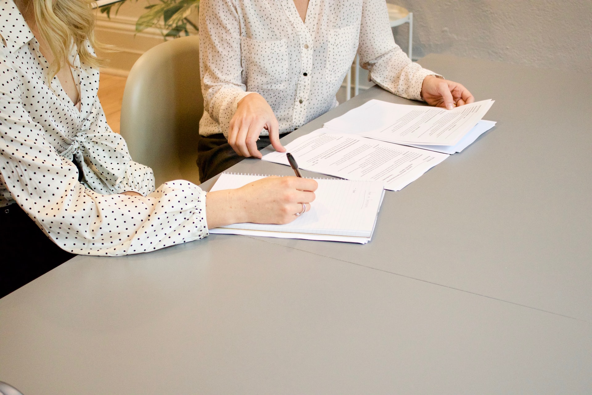 Two Persons Discussing Contractual Terms